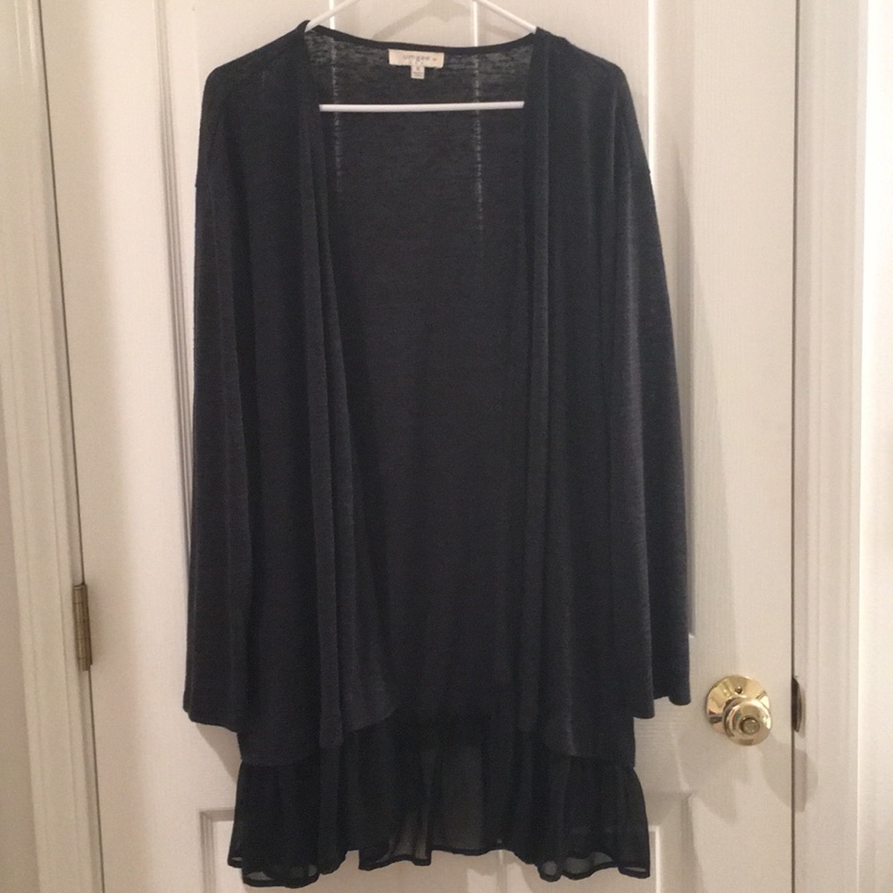 Cardigan with ruffle trim at the bottom